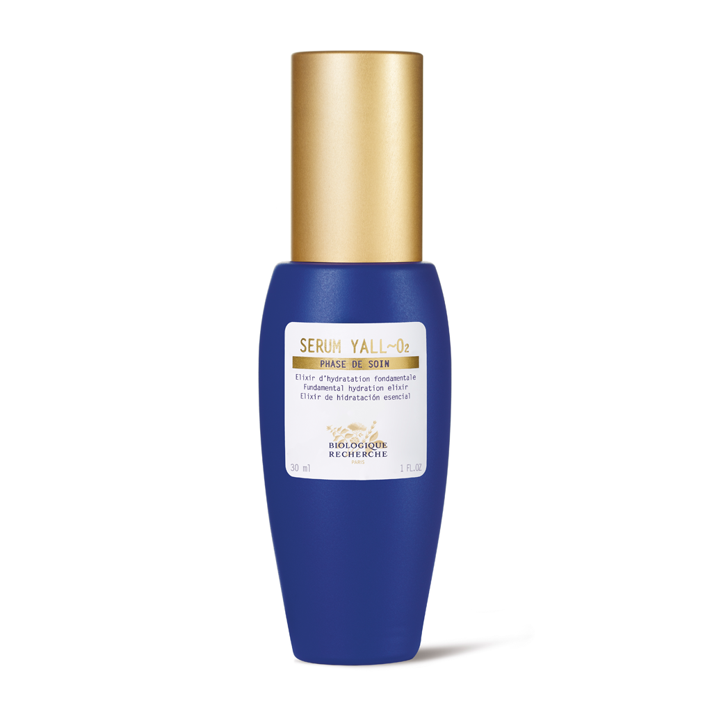 Blue serum bottle with gold cap on a white background