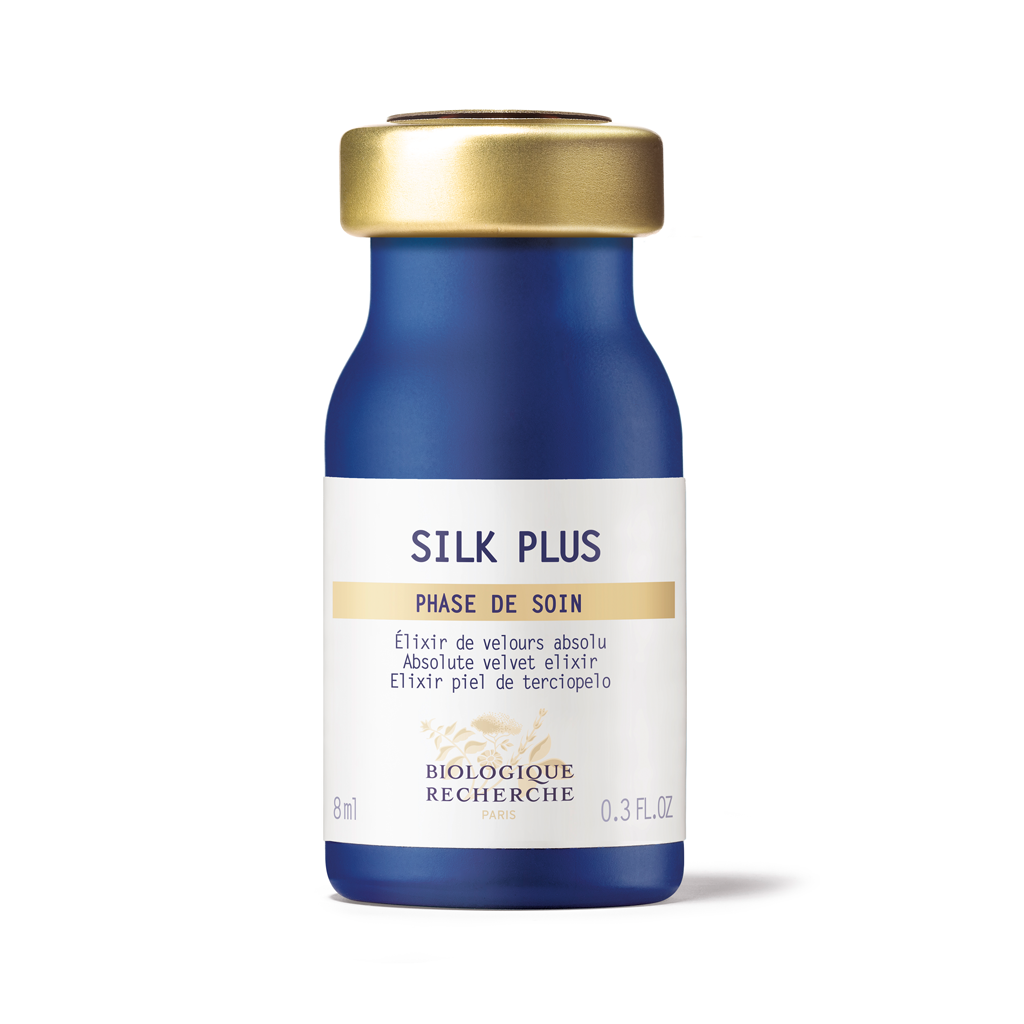 Blue bottle with gold cap labeled 'Silk Plus' on a white background